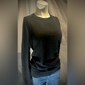 NWT. Women’s Black fitted sweater shirt made by the brand Paris Sunday. Size:M